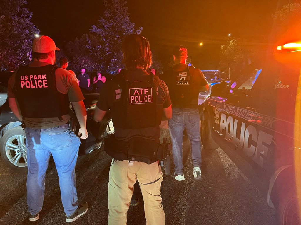 US Park Police and ATF officers arresting suspects.