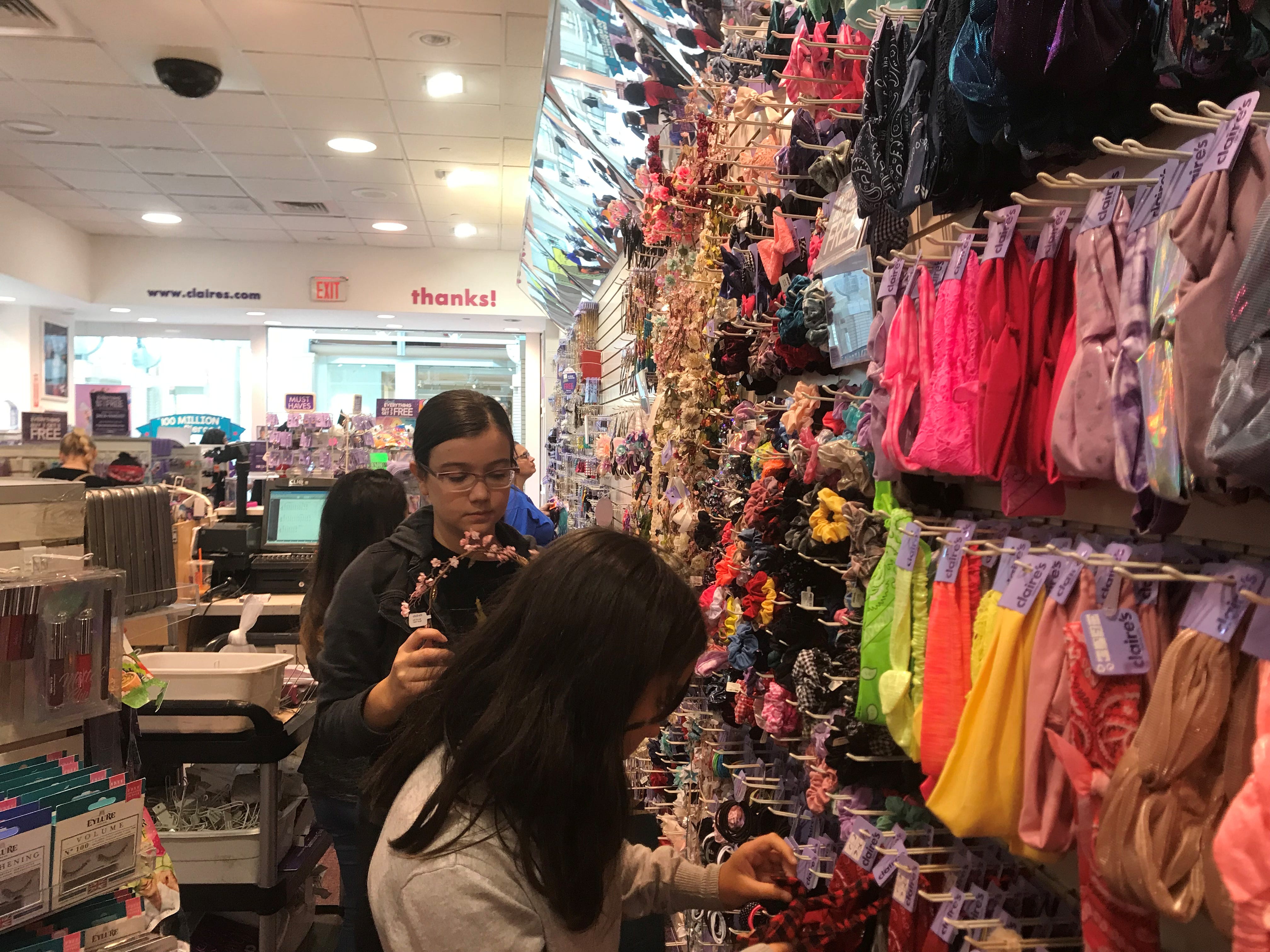 Shoppers in Claire's.