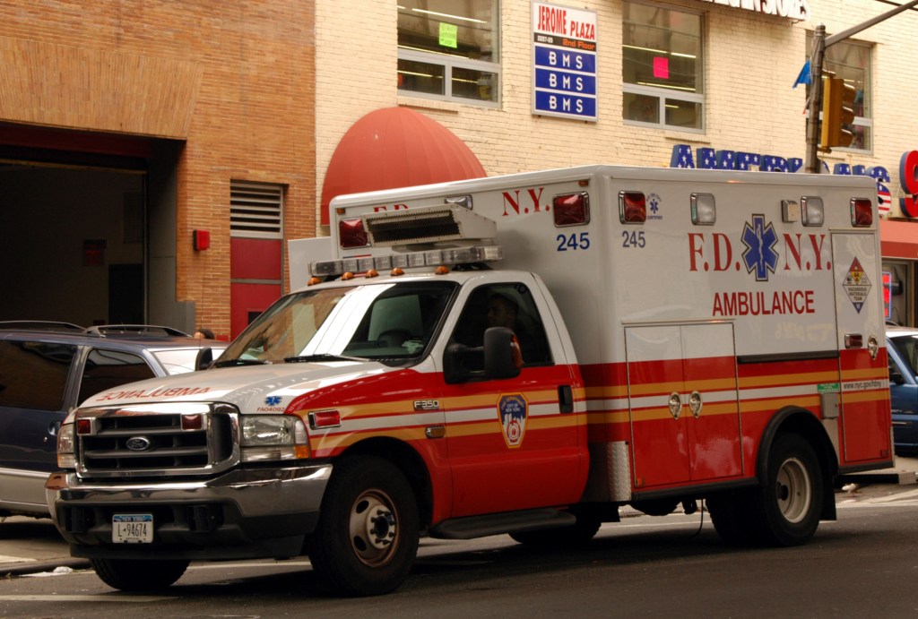 FDNY ambulance parked on city street.