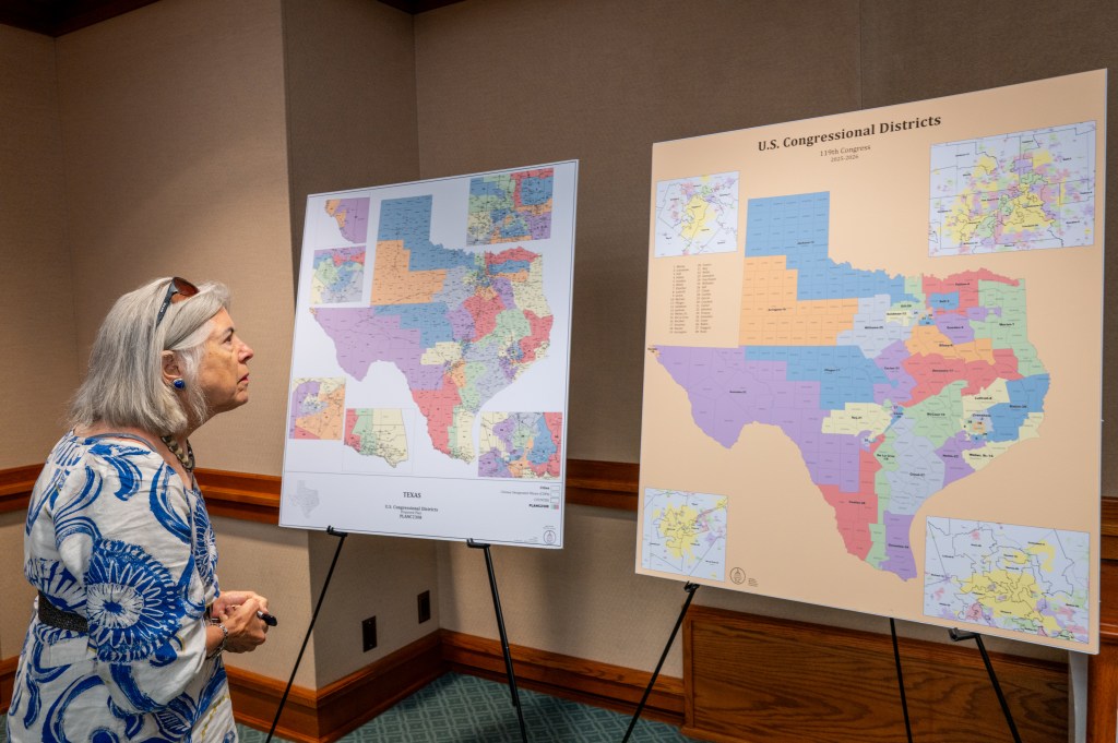 Woman looking at Texas congressional district maps.