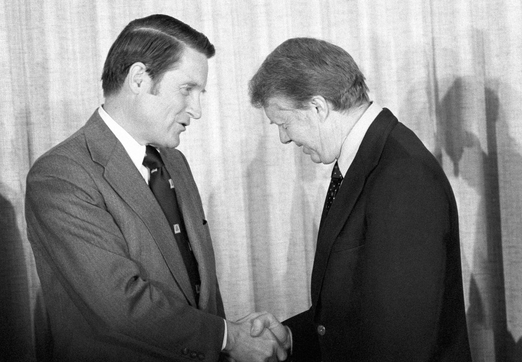 William H. Webster shaking hands with President Jimmy Carter.