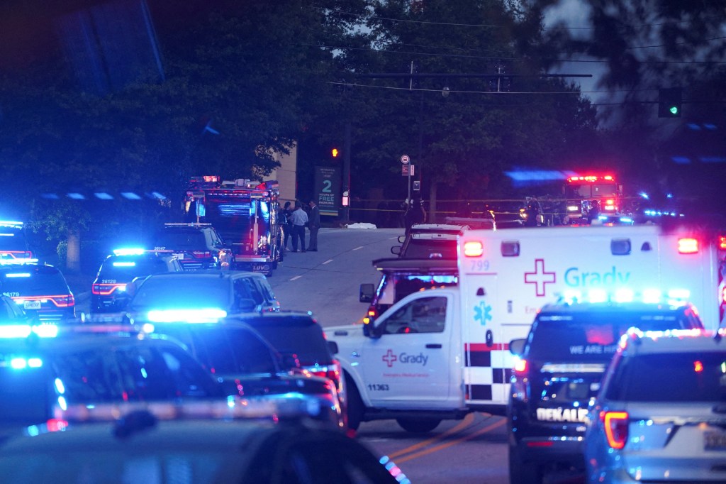 Emergency vehicles block a road outside Emory University and the CDC headquarters in Atlanta, Georgia following a shooting on Aug. 8, 2025.