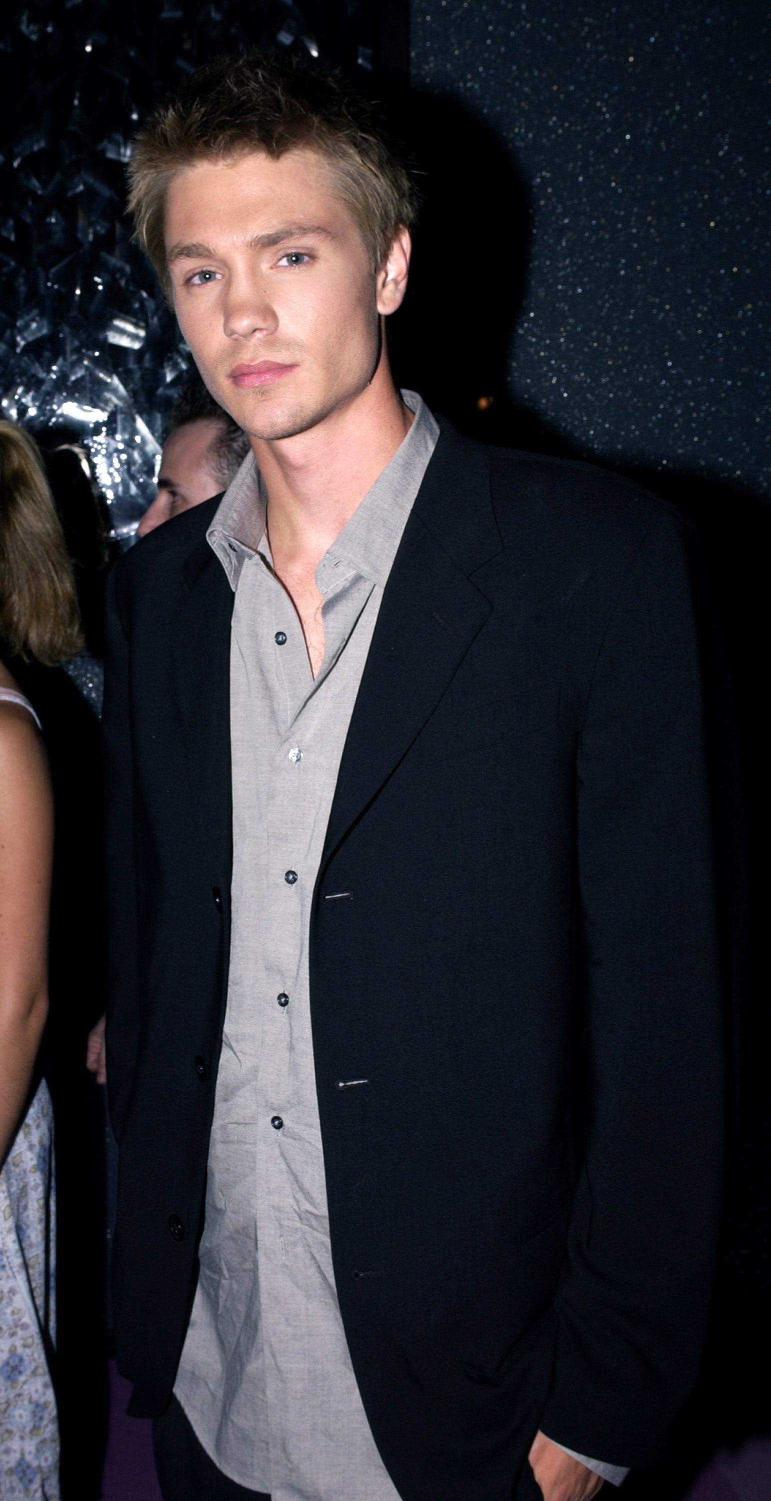 Chad Michael Murray in a dark blazer and grey shirt