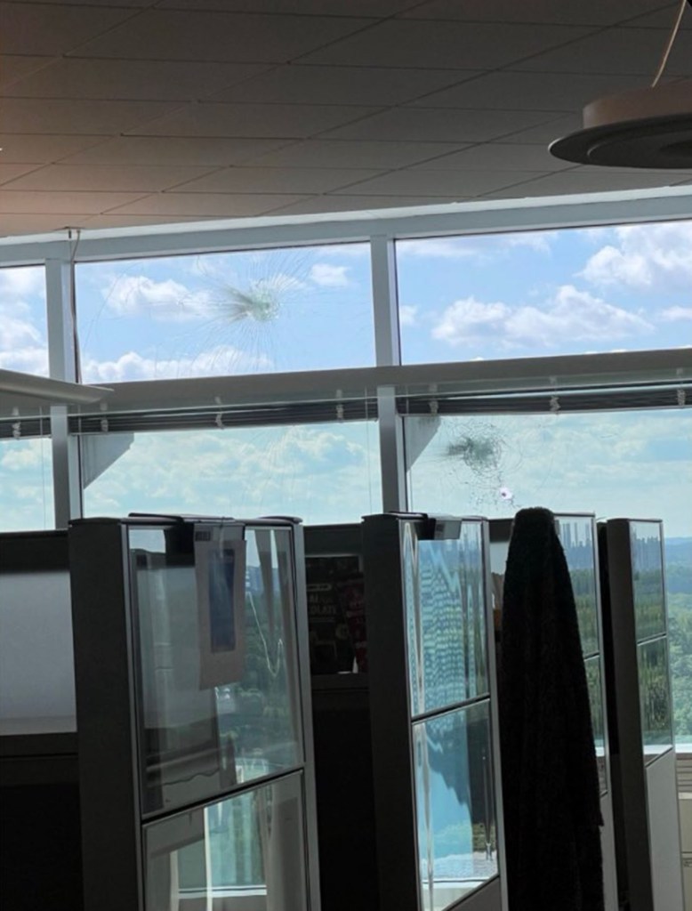 Bullet holes in a window inside the CDC building.