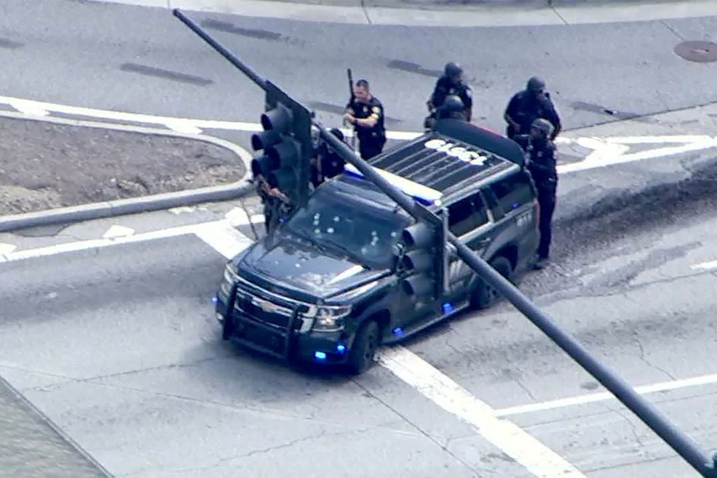 Police officers responding to an active shooter report near Emory University.