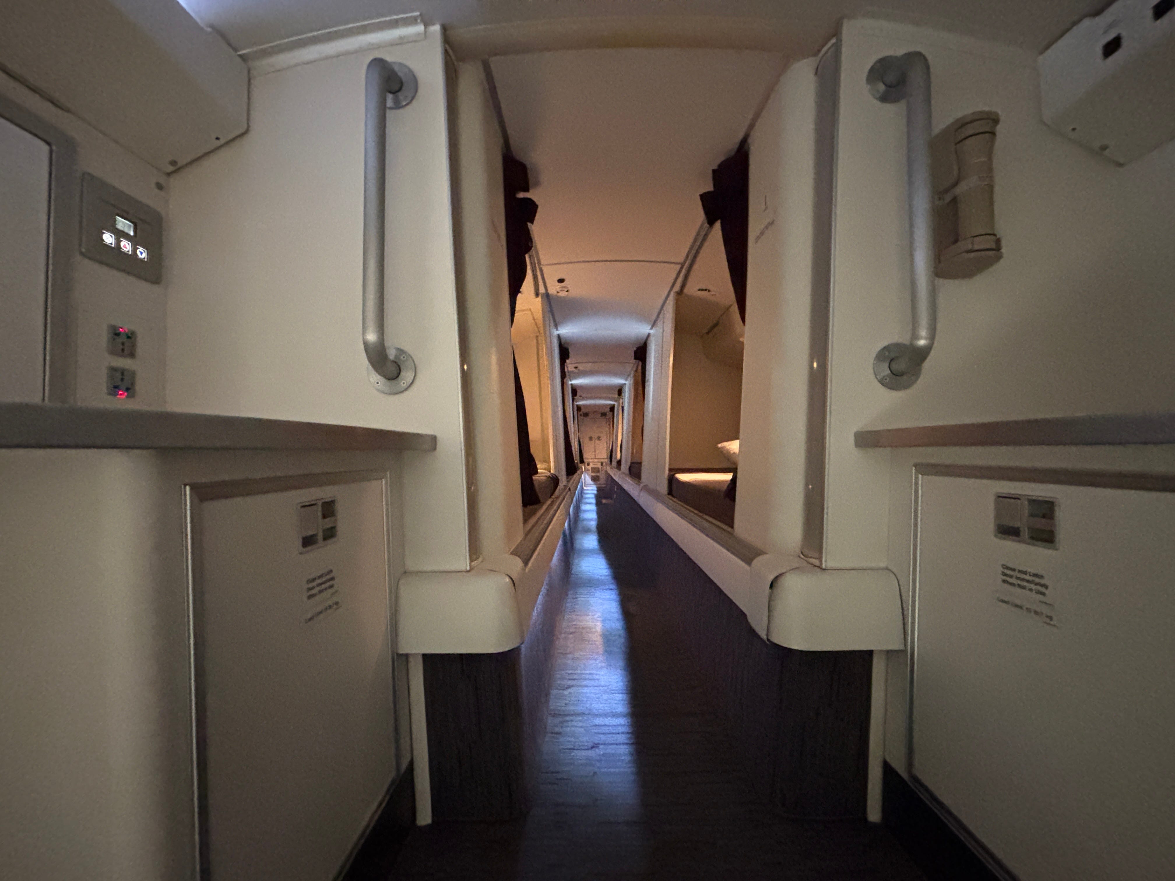 A view down the aisle of the crew rest area on a Boeing 777-300ER