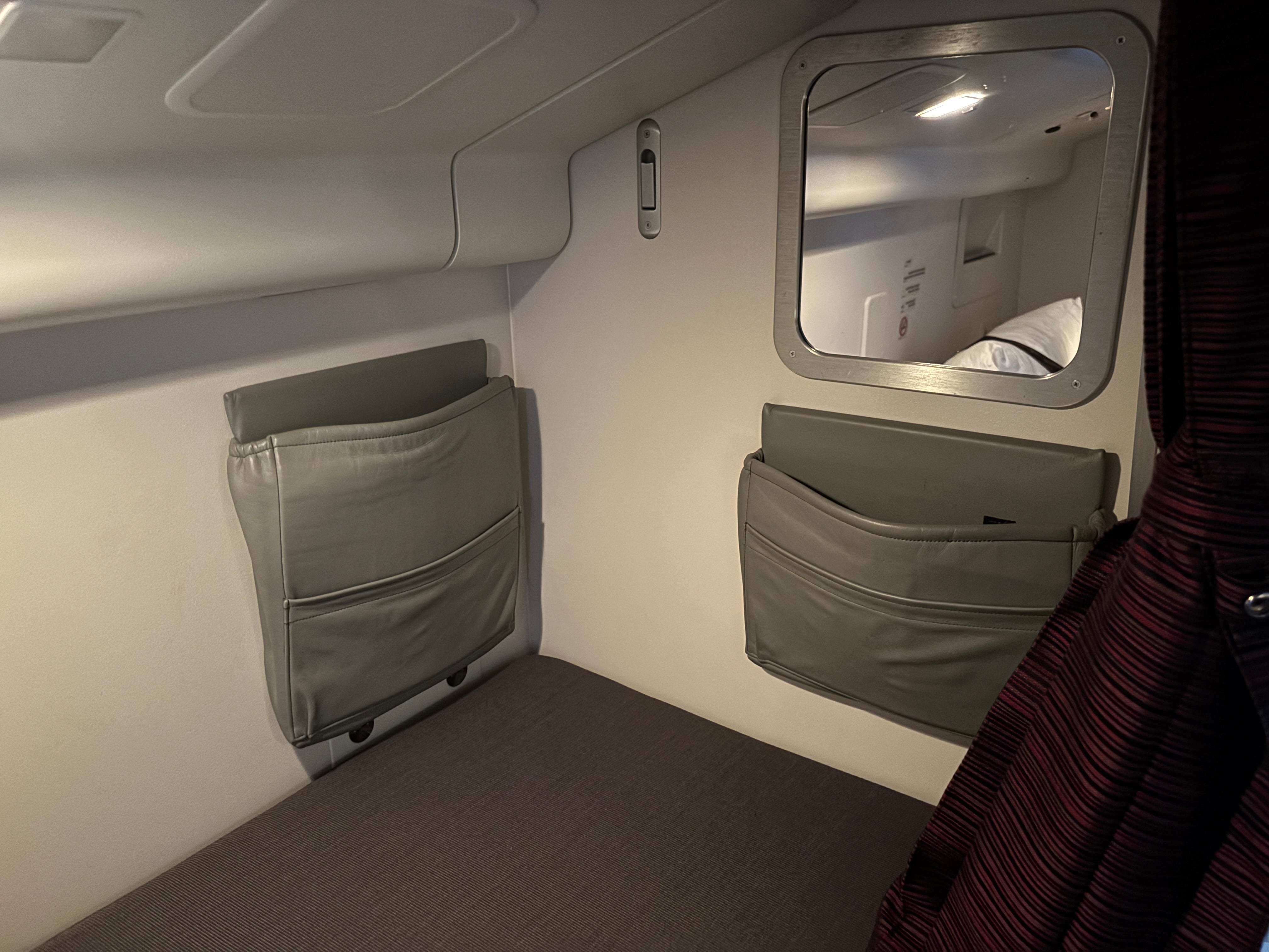 Storage pockets at the head of the bed on on a Boeing 777-300ER