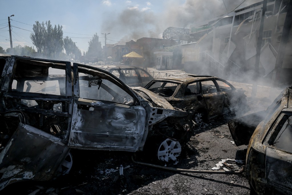 Destroyed cars sit at the site of a Russian Drone strike in the Donetsk region of Ukraine on Aug. 2, 2025.