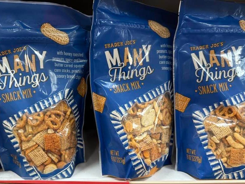 Bags of Trader Joe's Many Things snack mix on display.