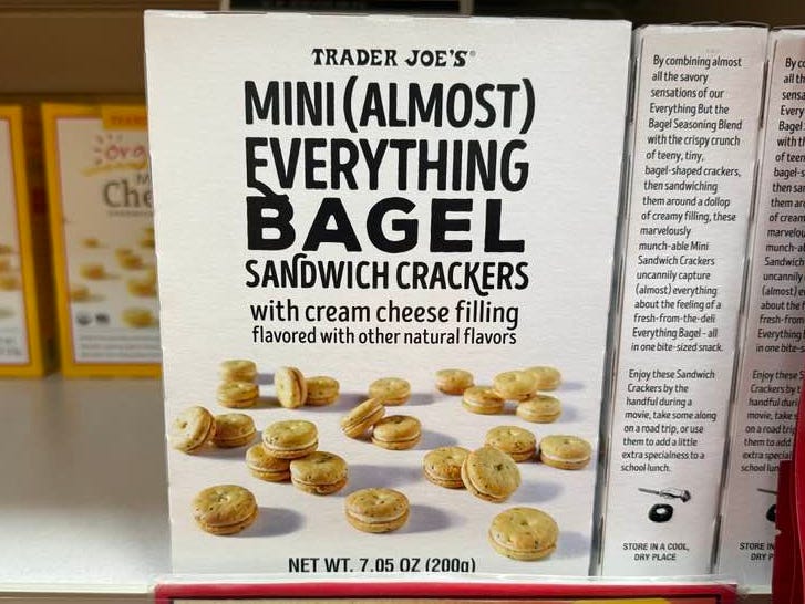 A box of Trader Joe's mini everything bagel sandwich crackers on display.