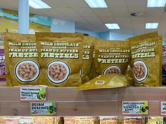 Trader Joe's chocolate covered pretzels on display on a shelf.