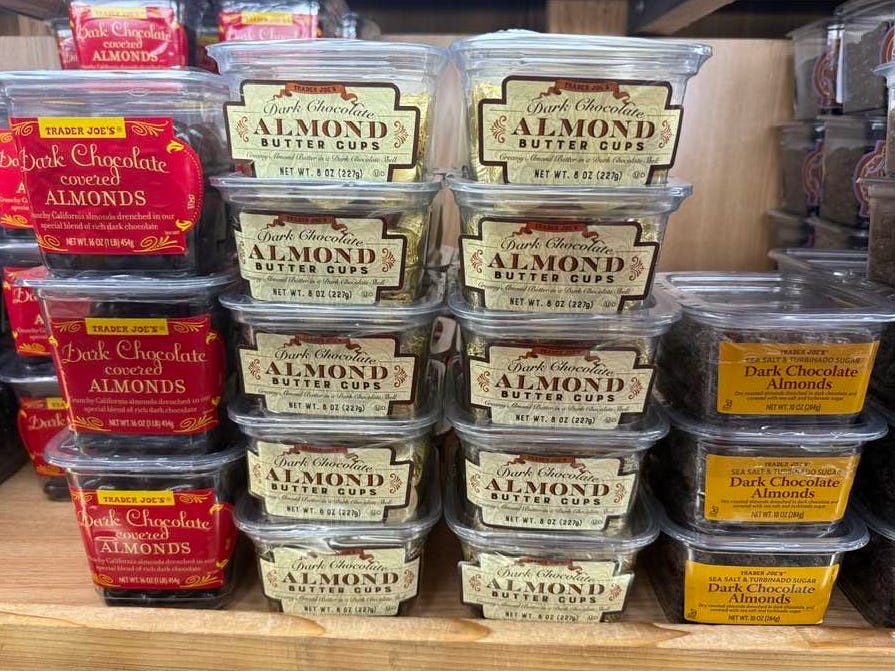 Trader Joe's dark chocolate almond butter cups on display on a shelf.