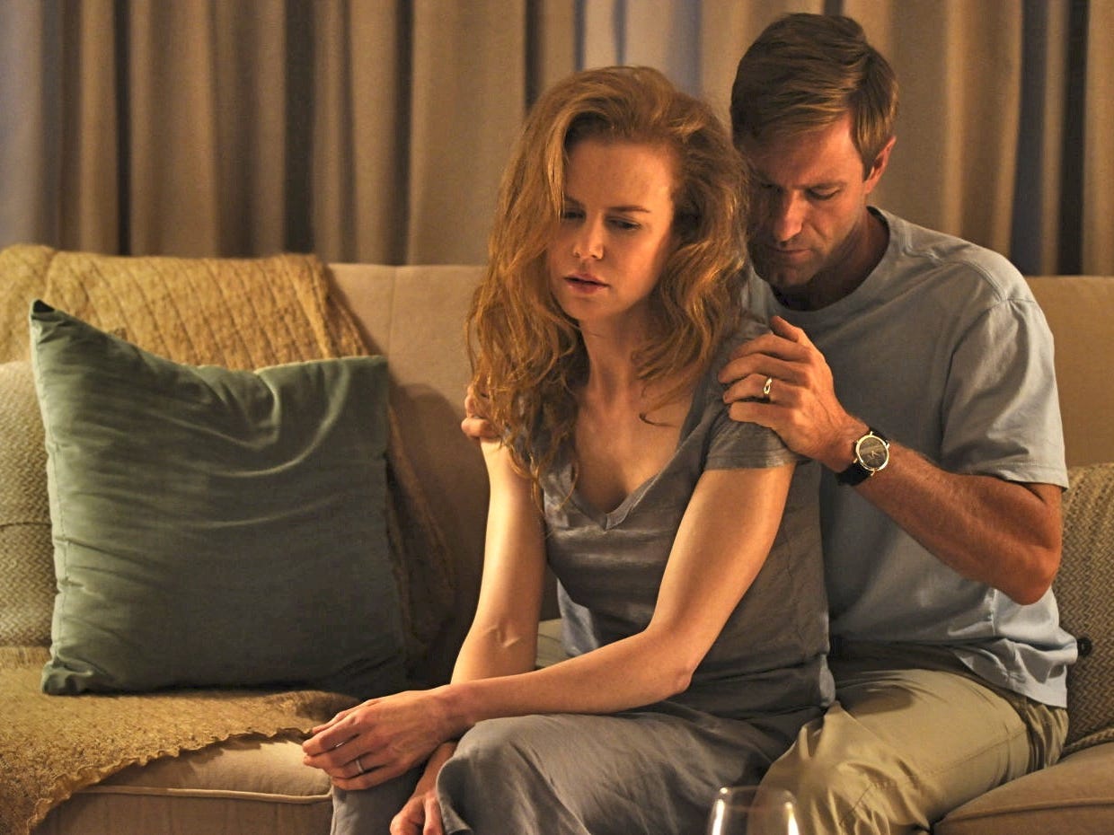 Aaron Eckhart holding Nicole Kidman