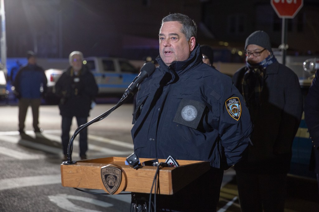 NYPD Deputy Commissioner Larry Byrne speaks at a memorial.