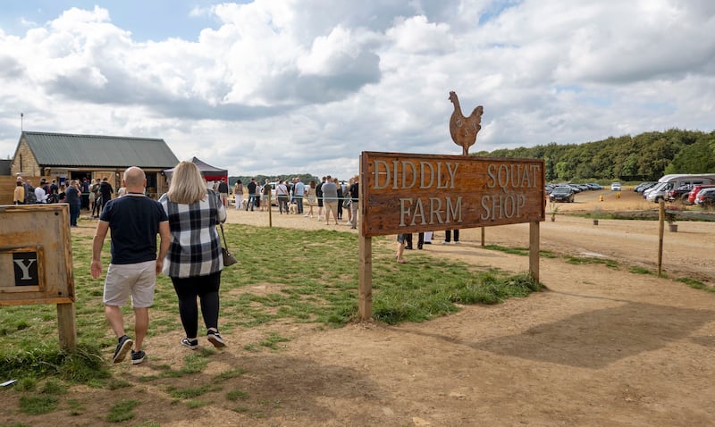 Customers queue at the popular Diddly Squat farm shop near to Chipping Norton in the Cotswolds region.