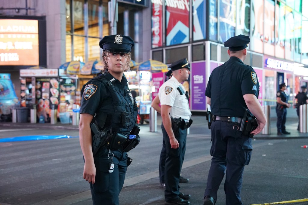 Police officers at a crime scene in Times Square.