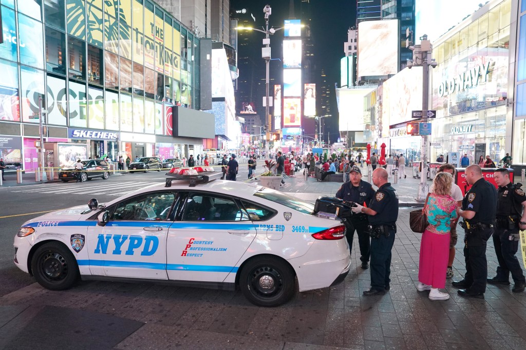 NYPD officers at a Times Square crime scene.