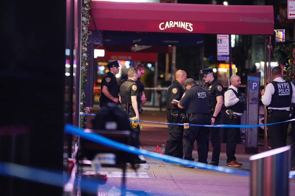 NYPD officers at a crime scene in Times Square.