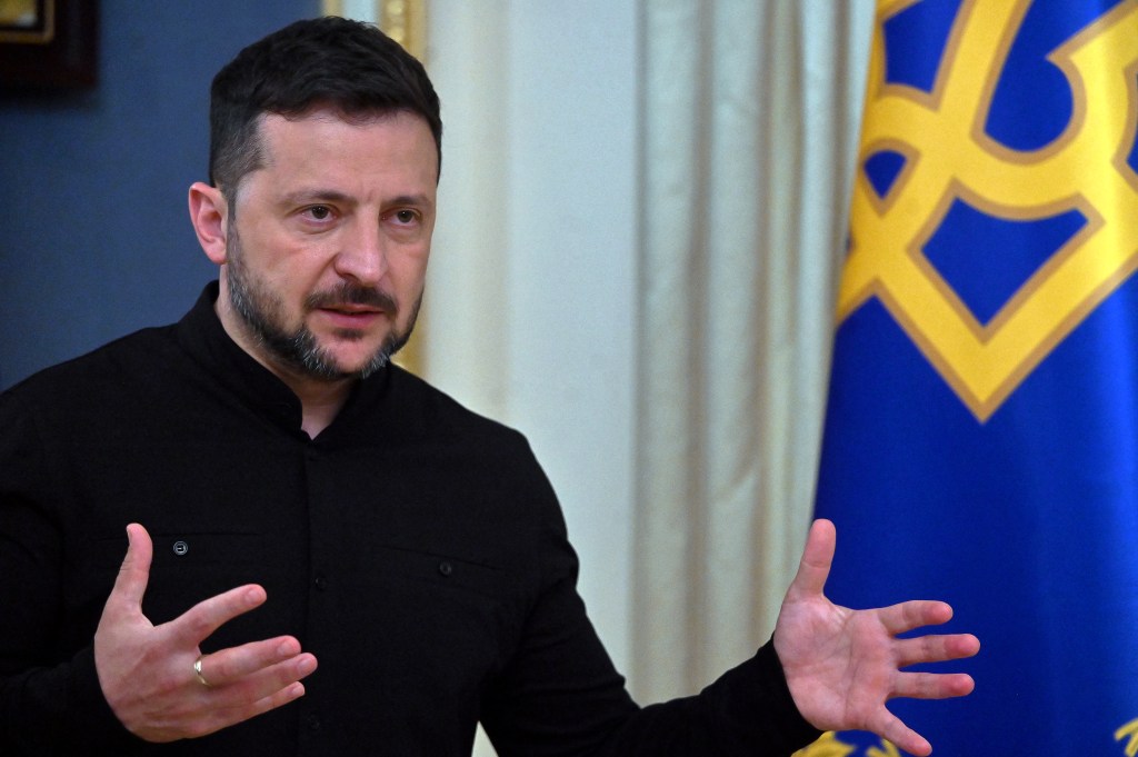 Volodymyr Zelensky speaking to the media.