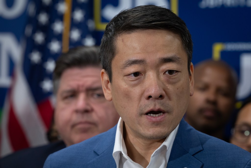 Headshot of Gene Wu speaking at a press conference.