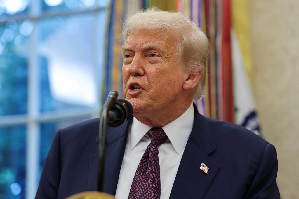 President Trump speaking at a podium in the Oval Office.