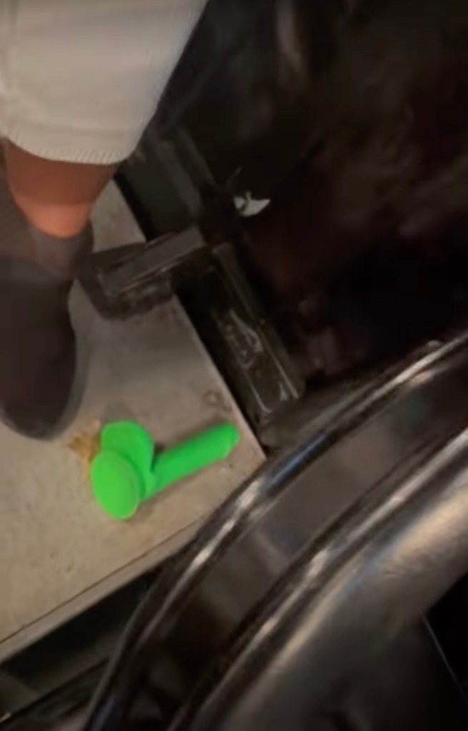 The bright green sex toy landed in the stands, missing the court and the players.