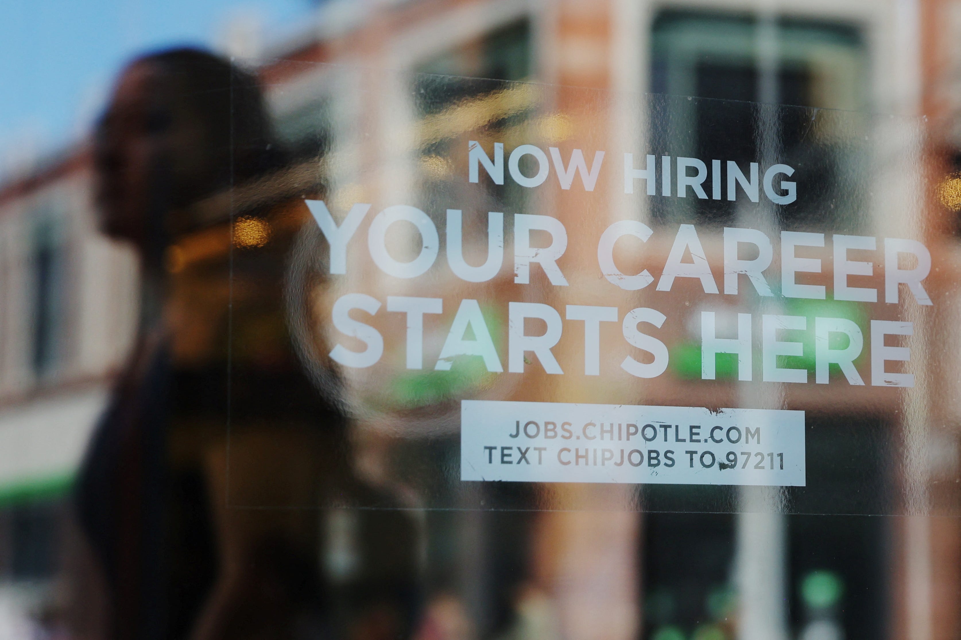 A Chipotle advertises hiring.