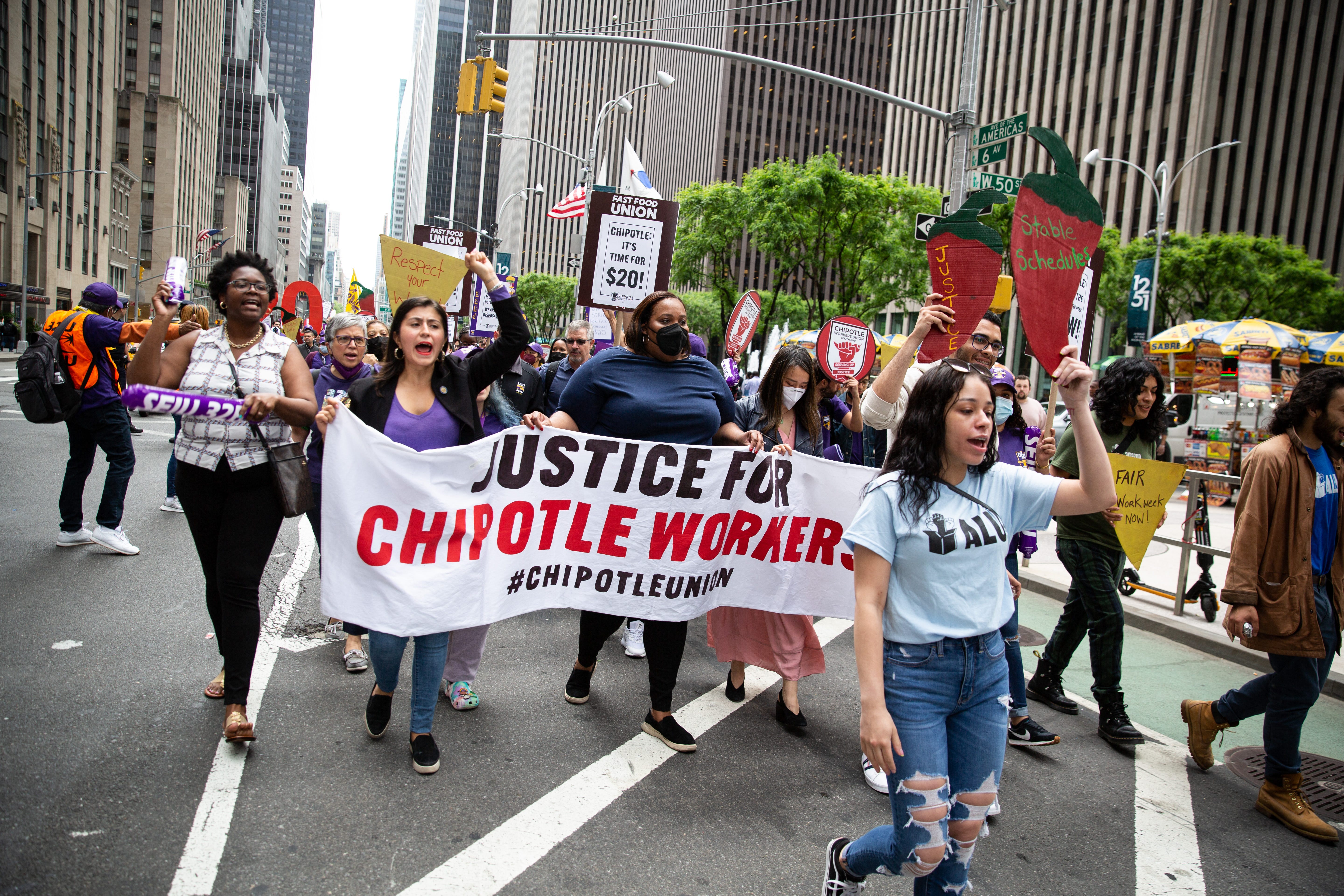 Current and former Chipotle workers marching to demand $20/hour wages and fair workplace practices.