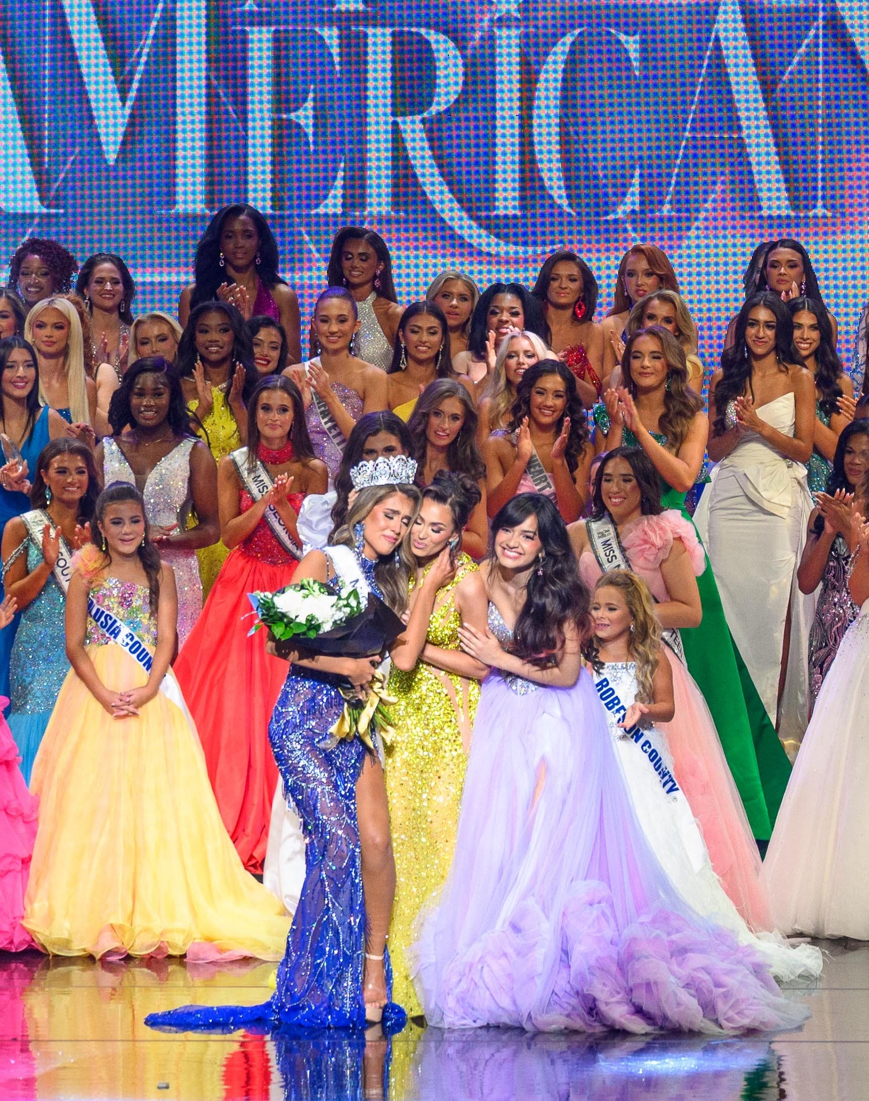 Noelia Voigt and UmaSofia Srivastava crowning the first Miss All-American.