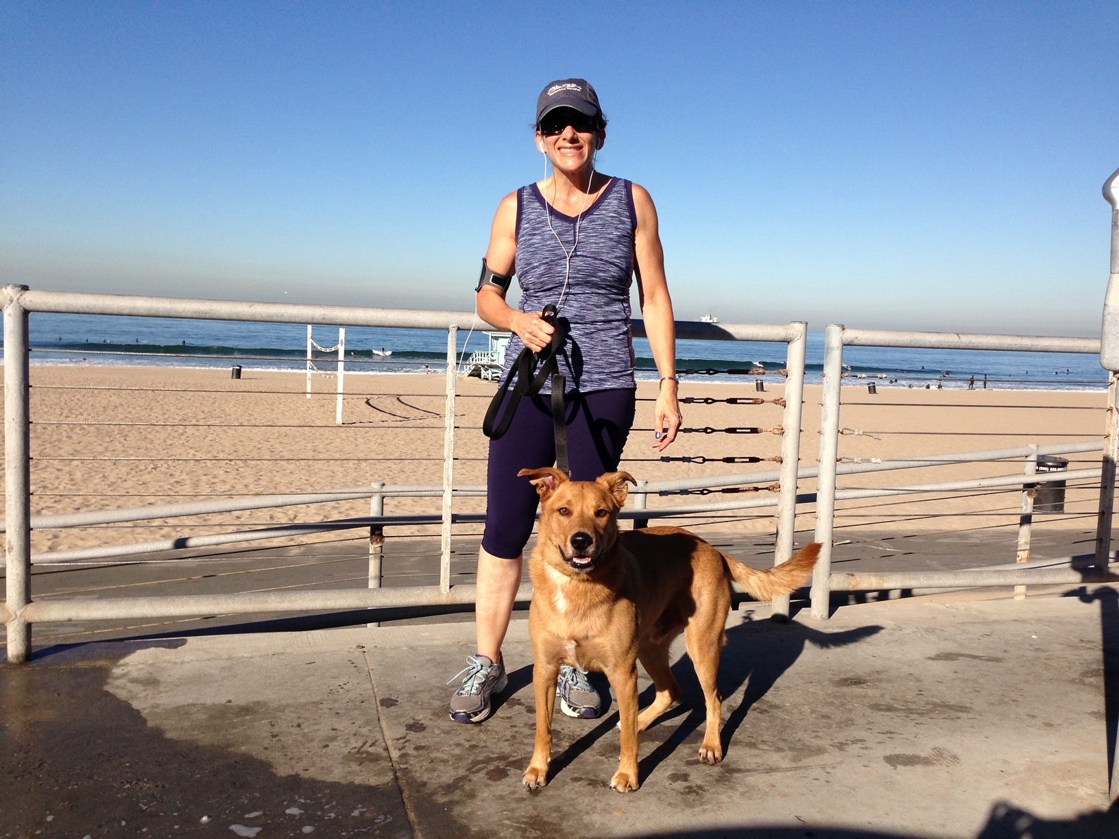 Cheryl Orlov and her dog near the beach in California.