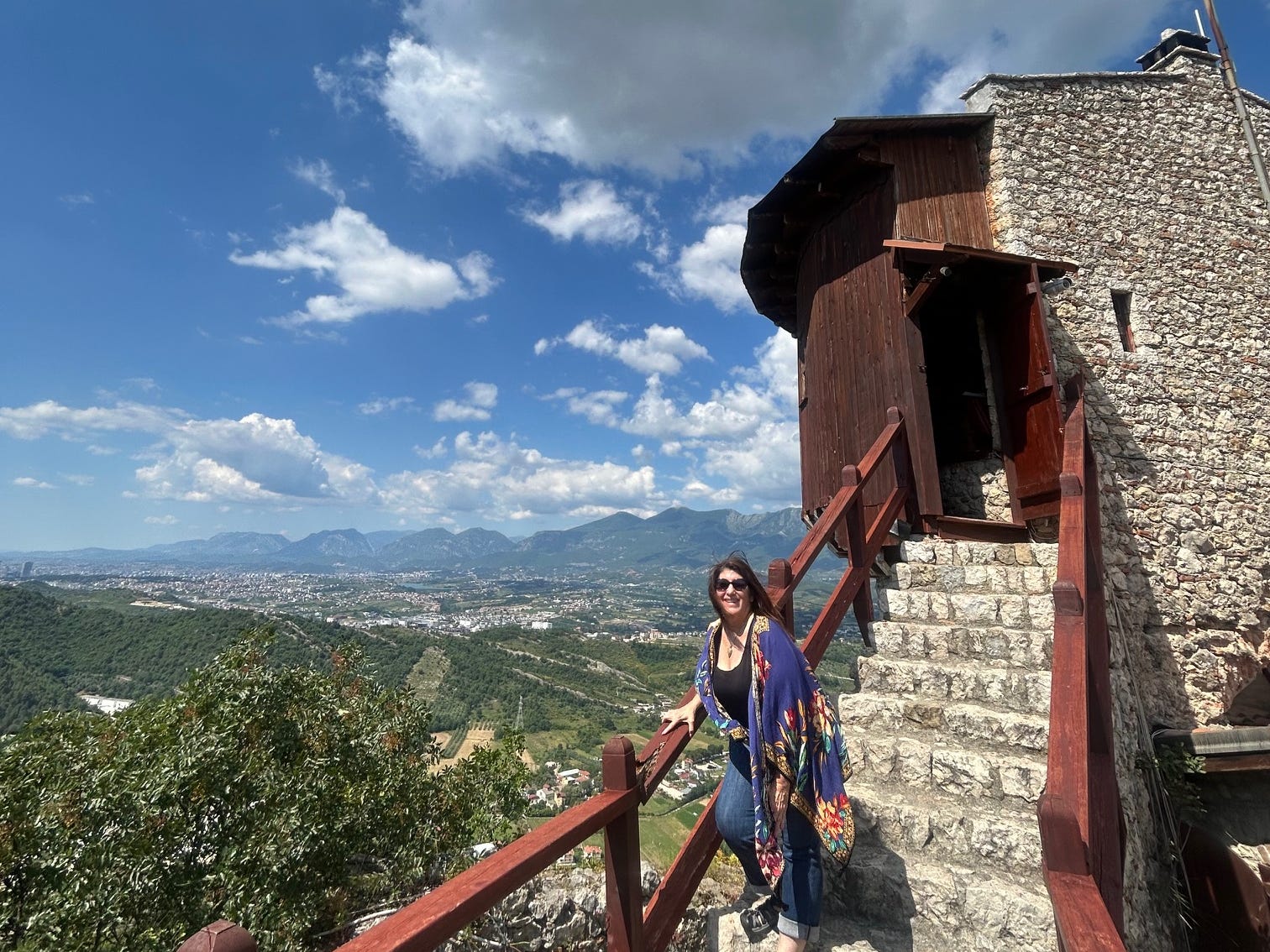 Cheryl Orlov standing on the steps of Krujë Castle in Krujë, Albania.