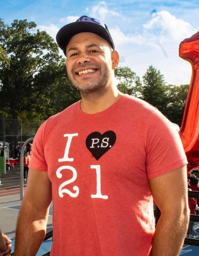 principal anthony cosentino in a tshirt which reads i heart ps 21