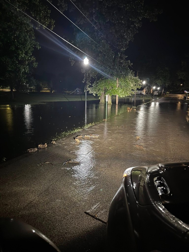 Flooded street at night.