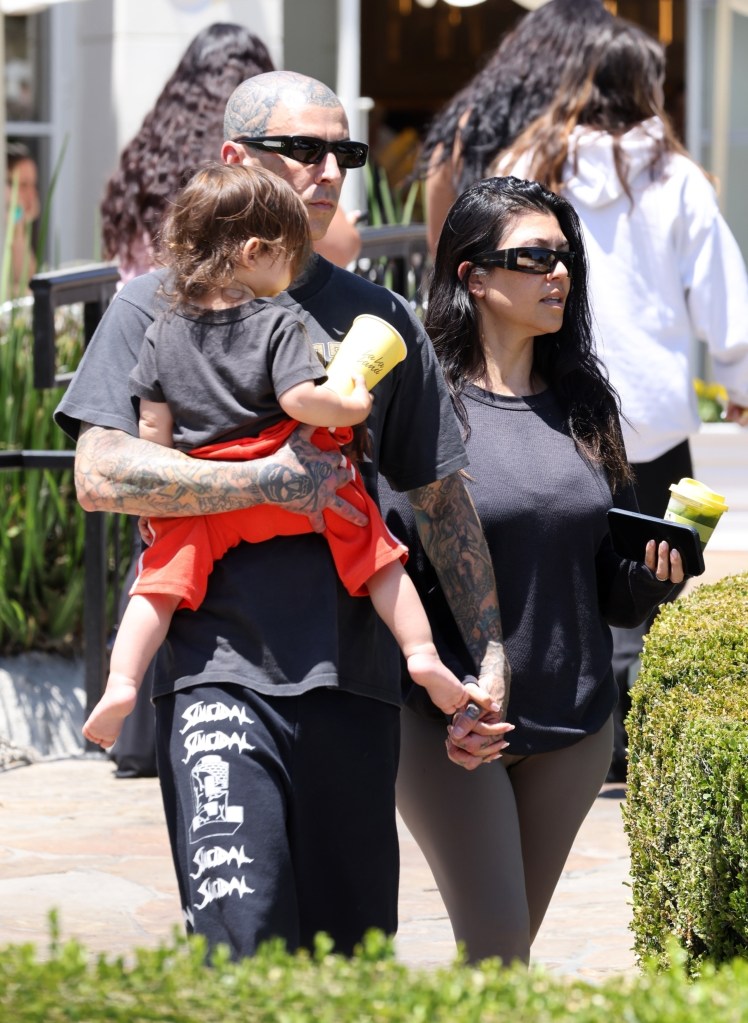 Kourtney Kardashian and Travis Barker walk hand in hand as they take baby Rocky to La LA Land for lunch in Calabasas in 2025