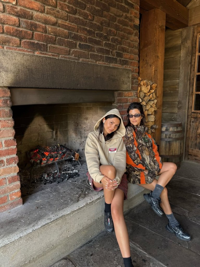 Kourtney Kardashian poses for a photo with a friend