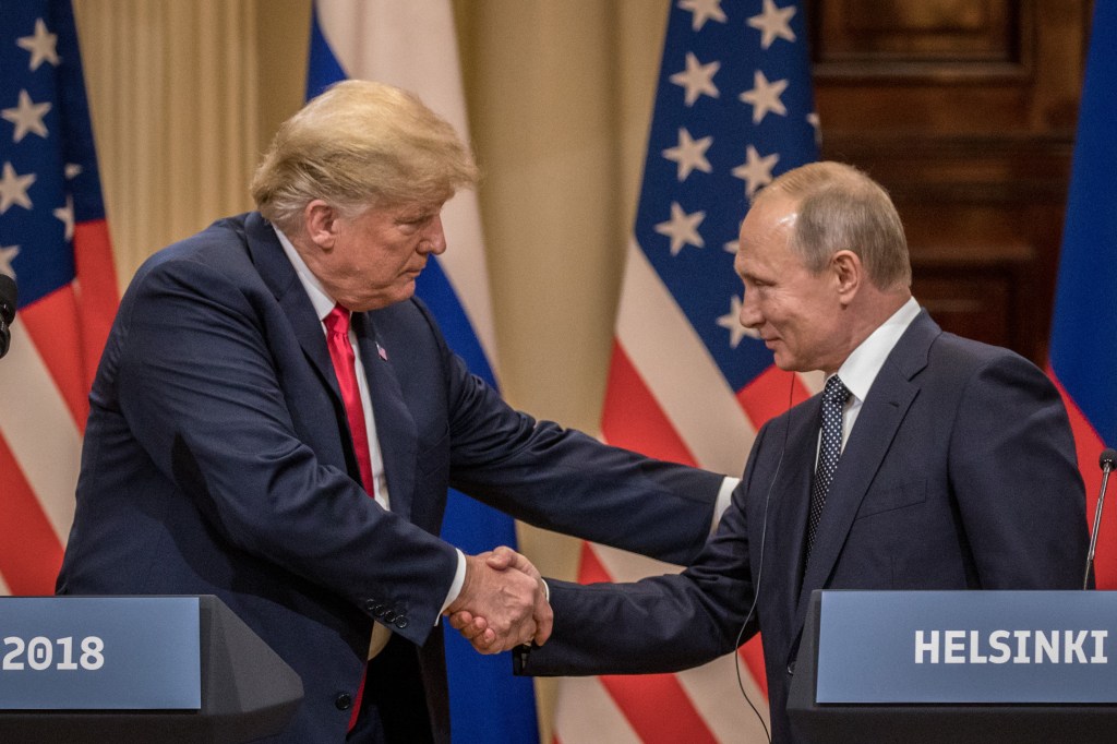 President Trump and President Putin shaking hands at a joint press conference in Helsinki.