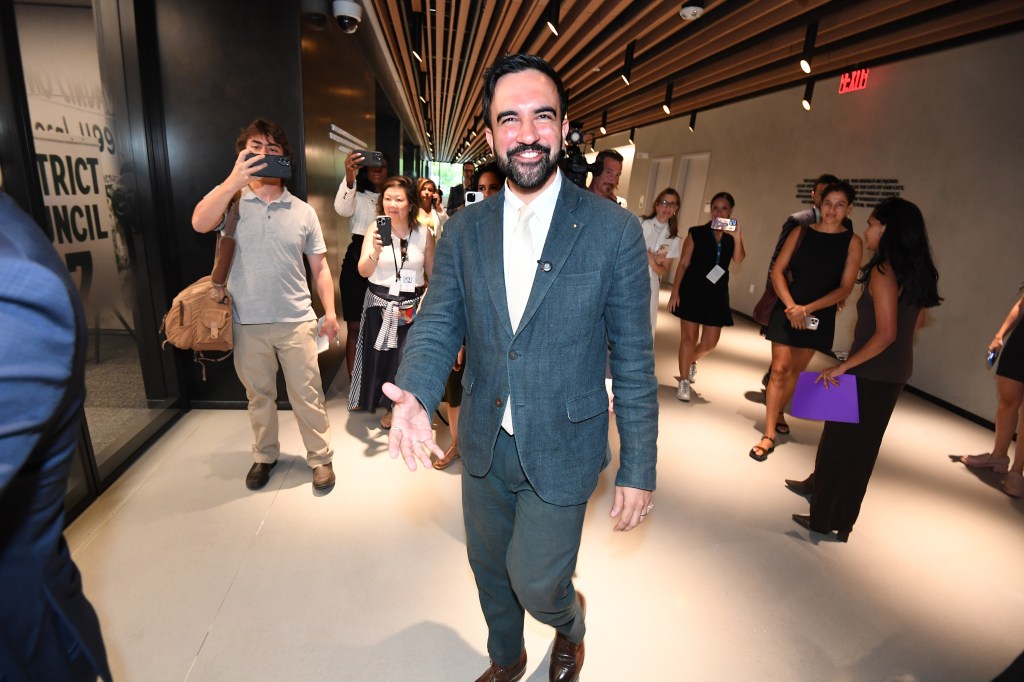 Zohran Mamdani, NYC mayoral candidate, greeted by supporters.