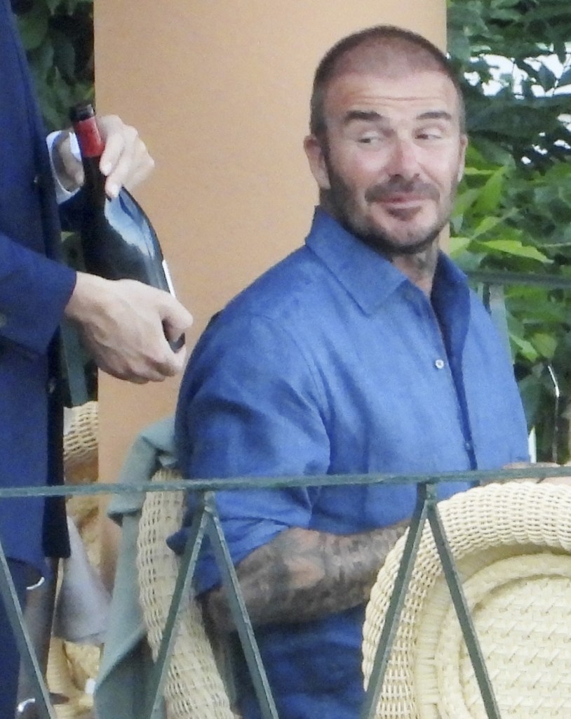 David Beckham talking to a waiter in Italy.