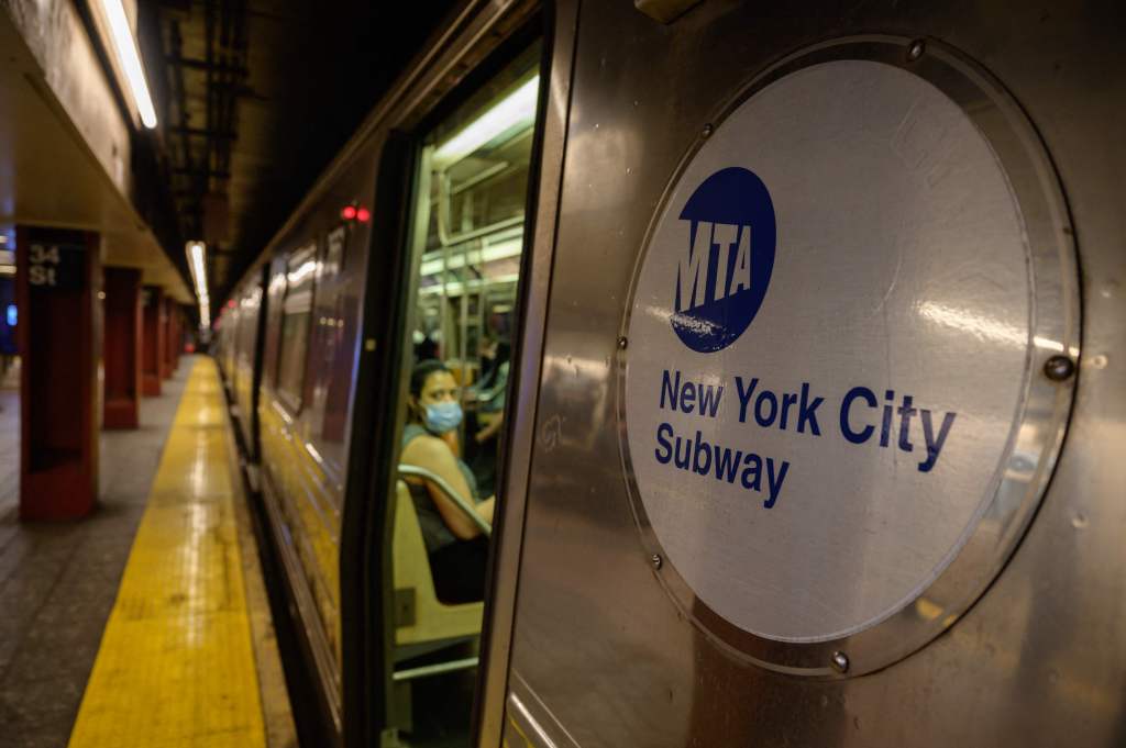 New York City Subway train with MTA logo.