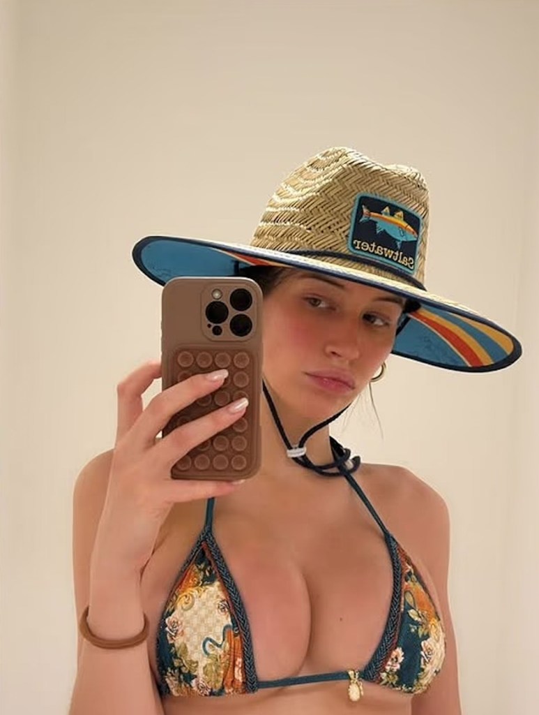Elsie Hewitt taking a selfie in a bikini.