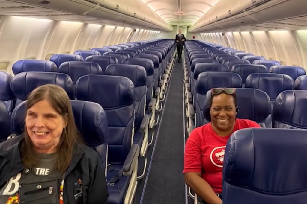 Two blind women seated on a Southwest Airlines plane.