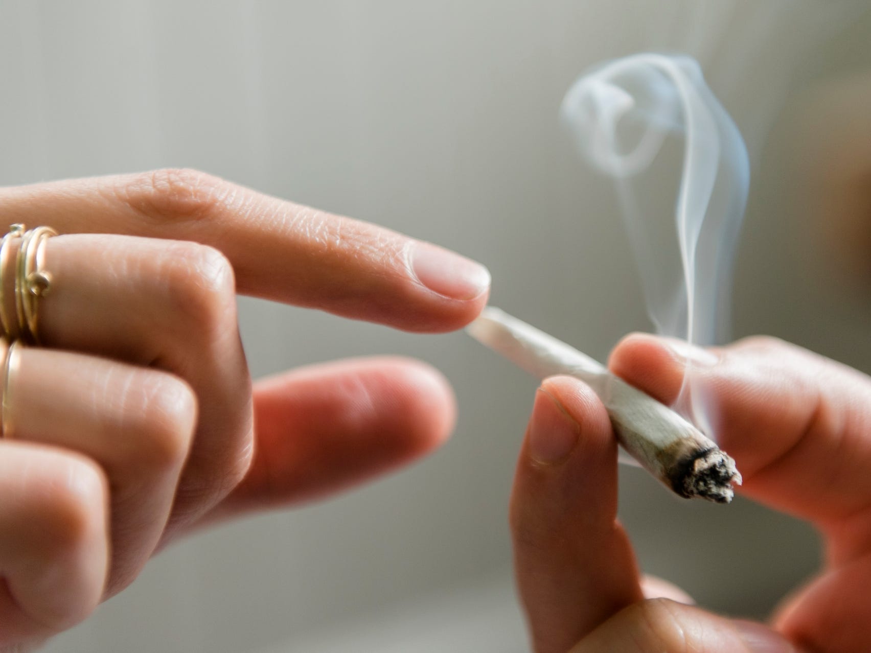 Hands passing a joint