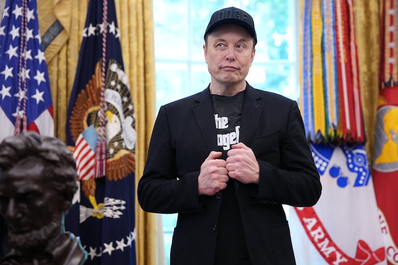 WASHINGTON, DC - MAY 30: Tesla CEO Elon Musk listens as U.S. President Donald Trump speaks to reporters in the Oval Office of the White House on May 30, 2025 in Washington, DC. Musk, who served as an adviser to Trump and led the Department of Government Efficiency, announced he would leave his role the Trump administration to refocus on his businesses. (Photo by Kevin Dietsch/Getty Images)