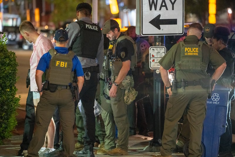 FBI and Border Patrol officers arrest a man along the U Street corridor during a federal law enforcement deployment to the nation's capital on August 10, 2025 in Washington, DC.