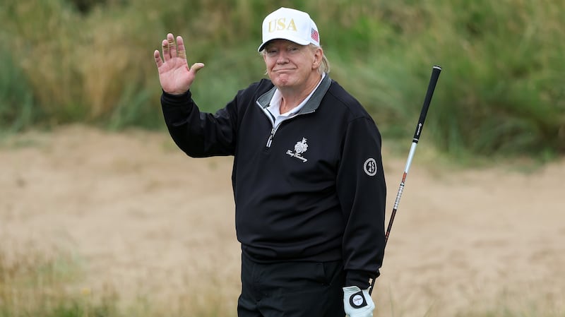 BALMEDIE, SCOTLAND - JULY 29: U.S. President Donald Trump holds a driver after teeing off during the opening of his new golf course at his Trump International Golf links resort on July 29, 2025 in Balmedie, Scotland. President Trump is visiting Scotland in a trip that’s part-vacation, part-work, as he stayed at his Trump Turnberry golf course, followed by Trump International Golf Links in Aberdeenshire, between July 25 to 29. (Photo by Jeff J Mitchell/Getty Images)