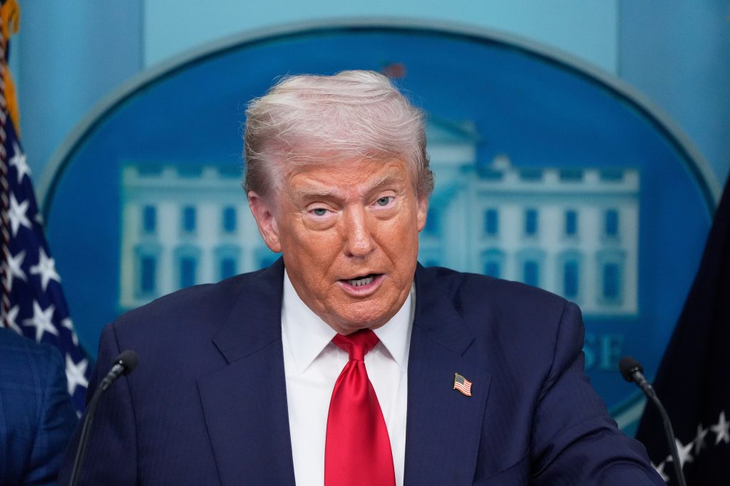 Donald Trump speaking at a press briefing.