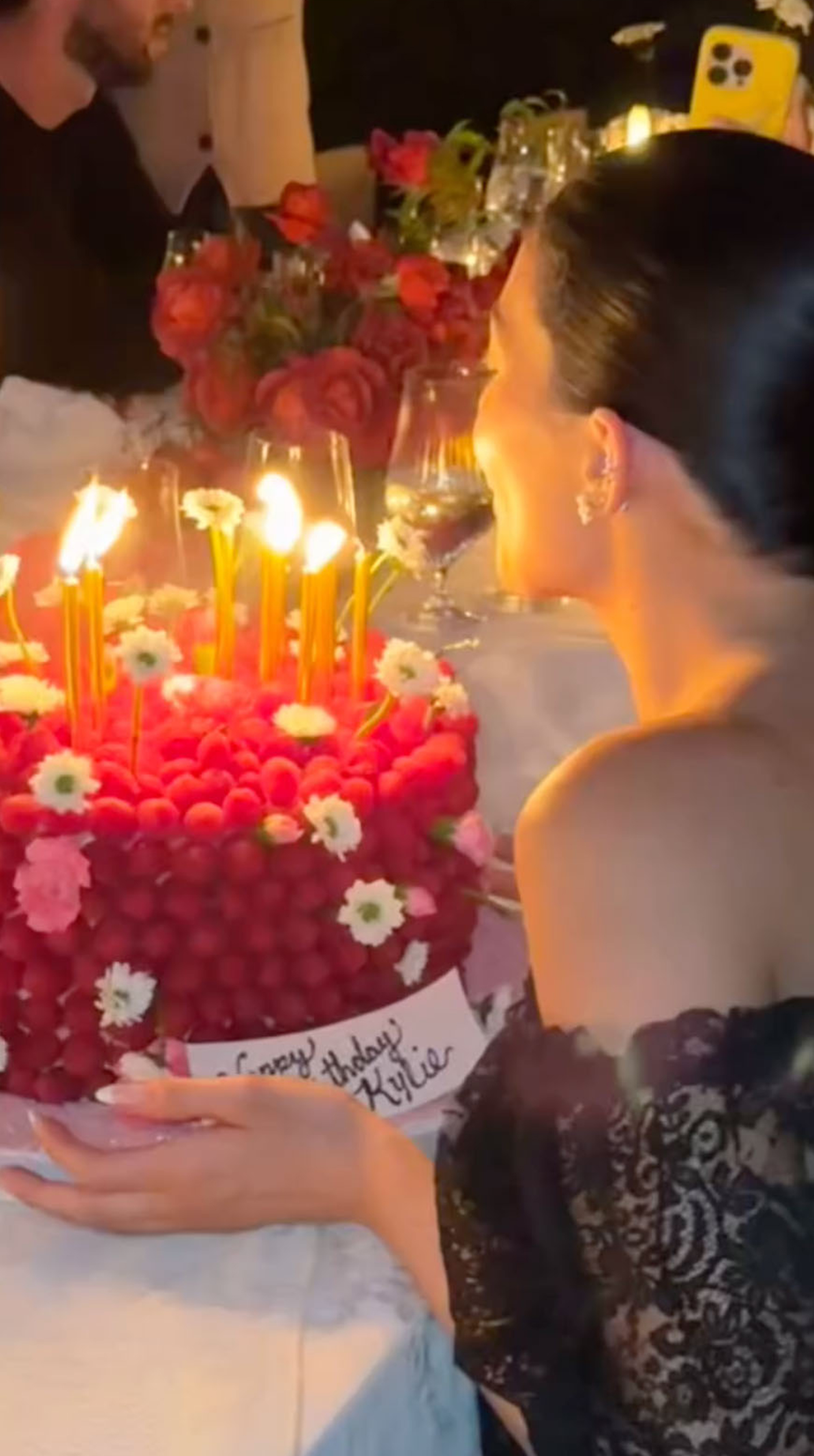 Kylie Jenner blowing out her birthday candles on her cake
