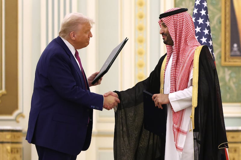 Donald Trump and Saudi Crown Prince Mohammed bin Salman attend a signing ceremony at the Saudi Royal Court on May 13, 2025, in Riyadh, Saudi Arabia.