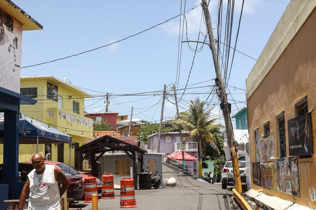 Utility poles and power lines in a San Juan, Puerto Rico neighborhood.