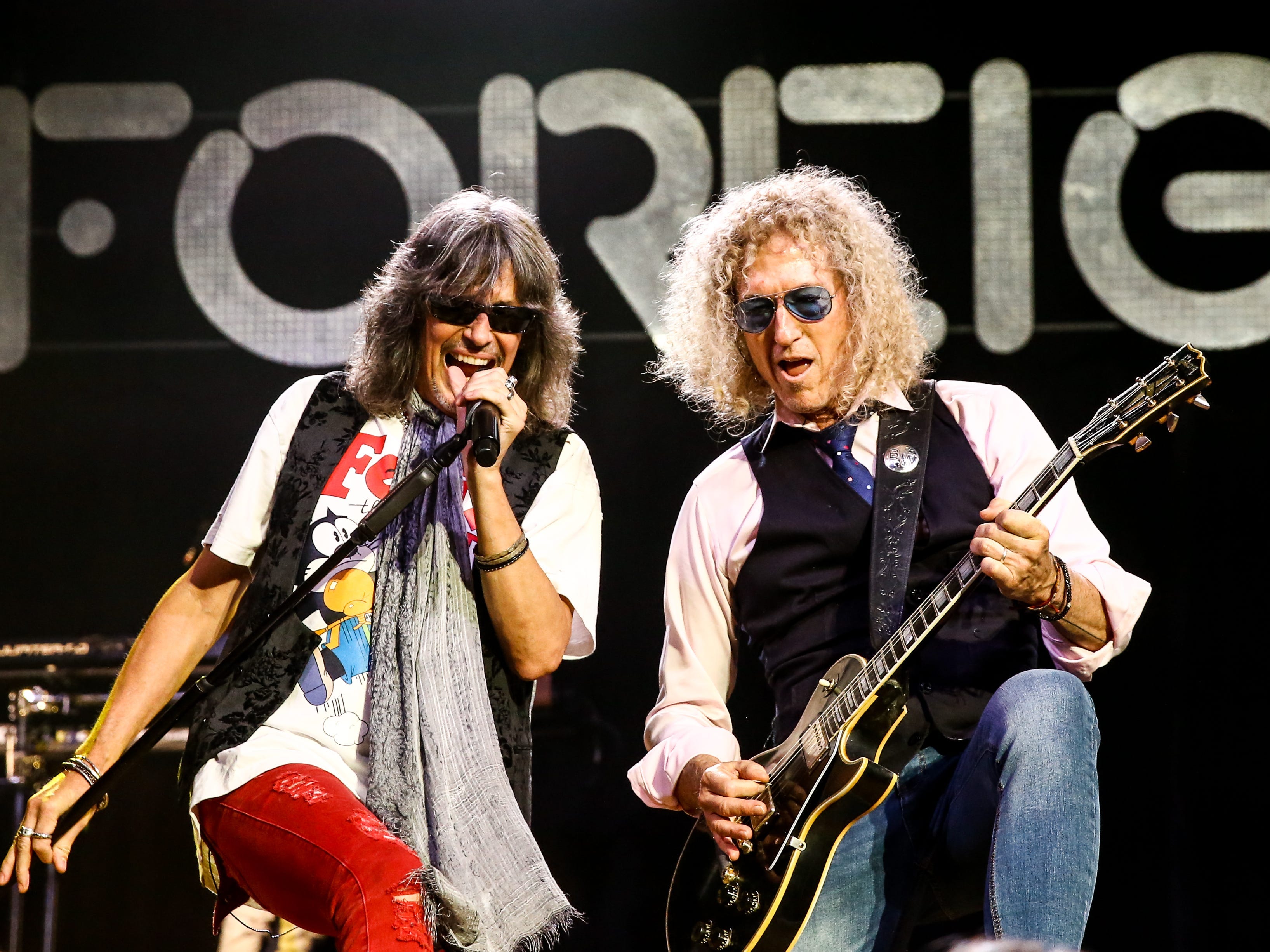 Kelly Hansen and Bruce Watson of Foreigner perform at Ryman Auditorium on August 18, 2021 in Nashville, Tennessee